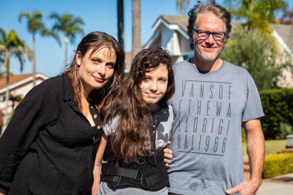 Sydney R. with her parents Jill Stabler and Christian R. in Laguna Niguel, Calif., on Jan. 21, 2021. (John Fredricks/The Epoch Times)