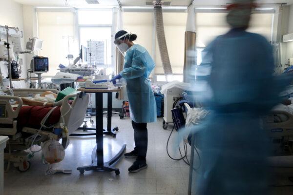 A registered nurse cares for COVID-19 patients in a makeshift ICU (Intensive Care Unit) at Harbor-UCLA Medical Center in Torrance, Calif., on Jan. 21, 2021. (Mario Tama/Getty Images)