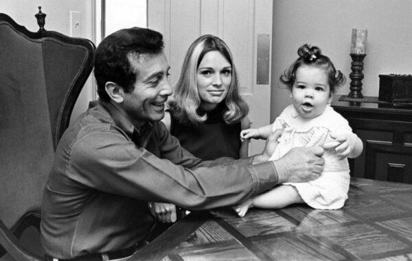 Alison Martino (R) sits with her parents. (Courtesy of Alison Martino)