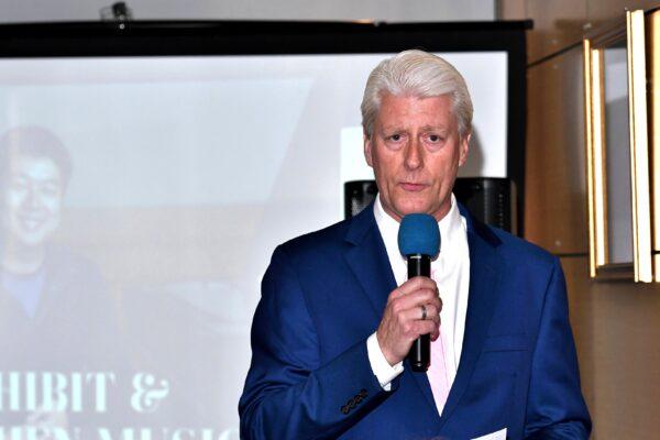 Dr. Dana Churchill speaks at "The Art of Zhen Shan Ren Art" exhibit he hosted in Fullerton, Calif., on Feb. 25, 2021. (William Kidston)