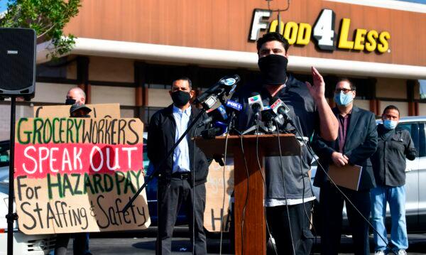 Robert Gonzales, Kroger employee for 26 years, addresses a crowd of supermarket workers gathered to protest in front of a Food 4 Less supermarket in Long Beach, Calif., on Feb. 3, 2021. (Frederic J. Brown/AFP via Getty Images)