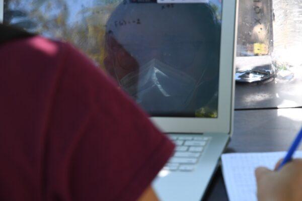 A High School senior student attends a remote class in the Boyle Heights neighborhood of Los Angeles, Calif., on Aug. 14, 2020. (Robyn Beck/AFP via Getty Images)