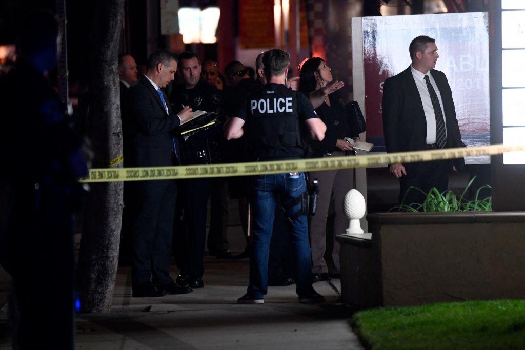 Police officers and agents stand outside an office building where multiple people were killed in a shooting in Orange, Calif., on March 31, 2021. (Patrick T. Fallon/AFP via Getty Images)