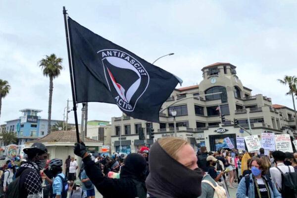 Black Lives Matter supporters gather in Huntington Beach, Calif., on April 11, 2021. (Tomas Morales)