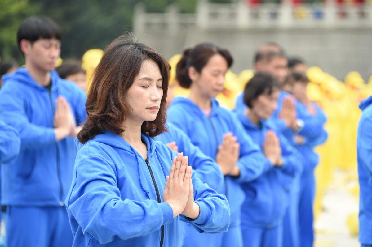 Falun Gong practitioners perform the exercises at an event celebrating World Falun Dafa Day in Taipei, Taiwan, on May 1, 2021. (Sun Hsiang-yi/The Epoch Times)