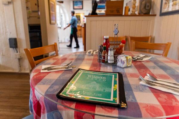 A set table in Wilma's Patio restaurant in Newport Beach, Calif., on June 4, 2021. (John Fredricks/The Epoch Times)