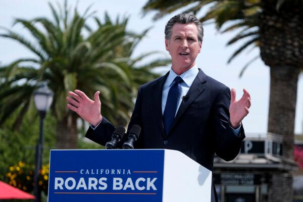 California Gov. Gavin Newsom talks during a news conference at Universal Studios in Universal City, Calif., on June 15, 2021. (Ringo H.W. Chiu/AP Photo)