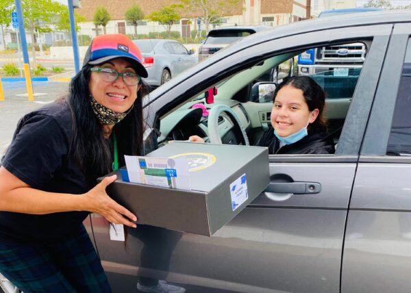 Dolores Garcia is shown next to a student. (Courtesy Dolores Garcia)