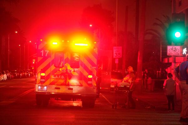 Emergency personnel work at the scene of a fireworks explosion in Los Angeles, Calif., on June 30, 2021. (Ringo H.W. Chiu/AP Photo)