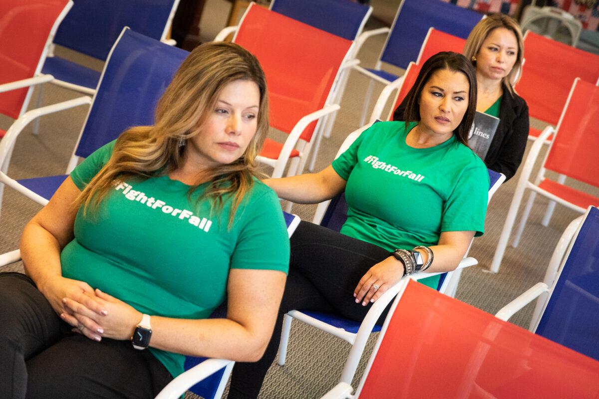 Parents Kimberly Hetherington Cataño (F) Celeste Fiehler (C), and Faustina Sevilla wear #FightForFall shirts in La Quinta, Calif., on June 16, 2021. (John Fredricks/The Epoch Times)