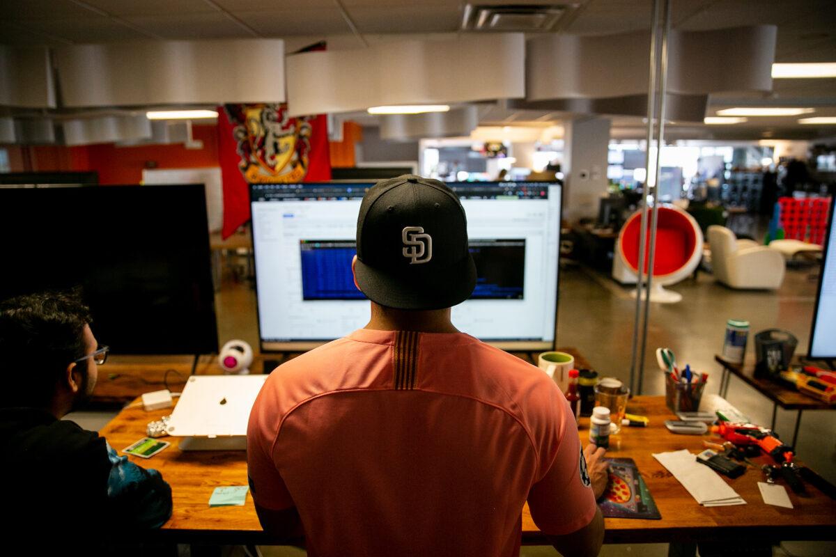 Software engineers work on an internet marketing company in San Diego on May 28, 2019. (Sam Hodgson/The San Diego Union-Tribune/TNS)