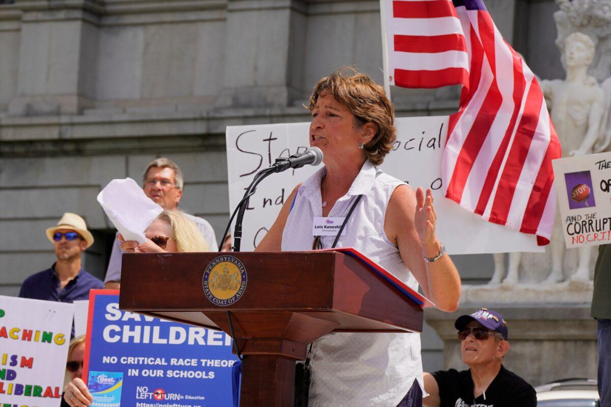 Lois Kaneshiki, along with the group Stop Common Core, CRT, & Action Civics in Pennsylvania, holds a rally at the Capitol in Harrisburg, Penn. on July 14, 2021. (Steve Wen/Epoch Times)