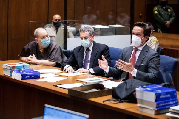 Harvey Weinstein, the 69-year-old convicted rapist and disgraced movie mogul, left, sits with his attorneys Mark Werksman, center, and attorney Alan Jackson during a pre-trial hearing in Los Angeles on July 29, 2021. (Etienne Laurent/Pool Photo via AP)