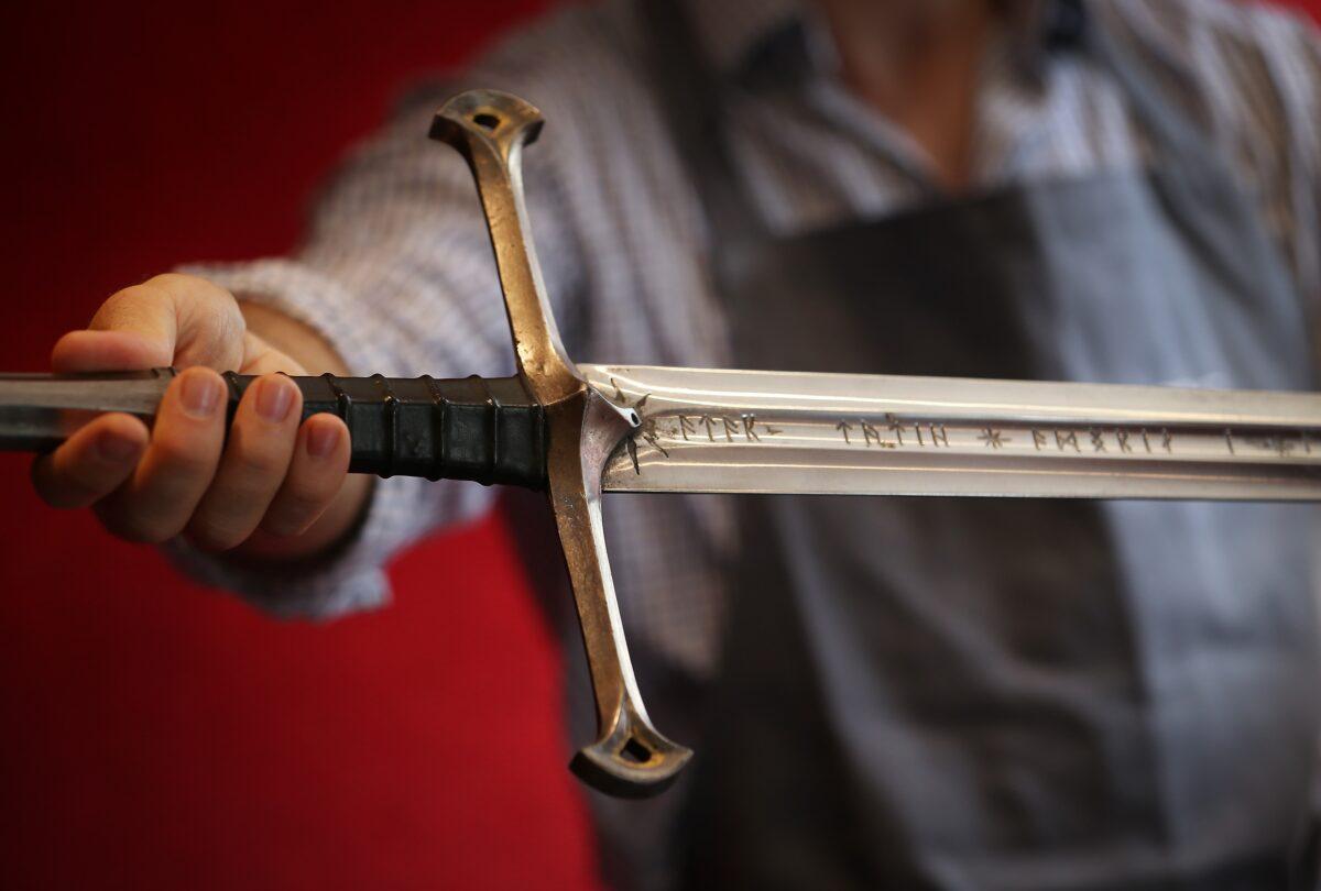 A Bonhams employee holds "Anduril" a prop sword belonging to Aragorn, hero of "The Lord of the Rings" movie trilogy in London, on July 31, 2014. (Peter Macdiarmid/Getty Images)