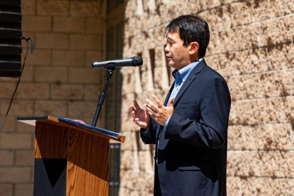 Sen. Dave Min presents a check for $15,000,000 to the Orange County Fire Authority at Fire Station 1 in Tustin, Calif., on Aug. 27, 2021. (John Fredricks/The Epoch Times)
