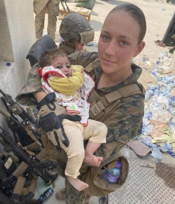 Sgt. Nicole Gee holding a baby at Hamid Karzai International Airport in Kabul, Afghanistan in an undated photo. (U.S. Department of Defense via AP)