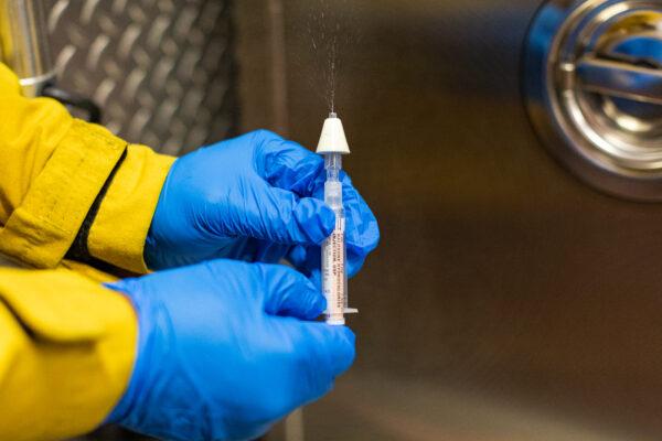 A firefighter displays Narcan; a lifesaving medication used to treat drug overdoses, on Feb. 26, 2021. (John Fredricks/The Epoch Times)