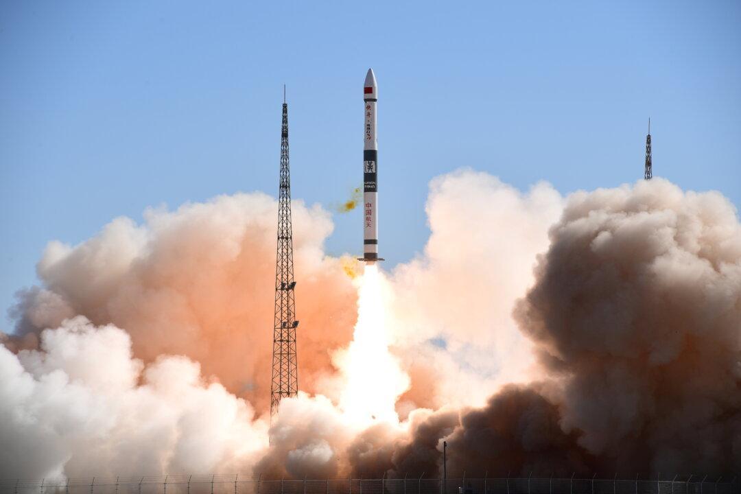 A Kuaizhou-1A carrier rocket carrying two satellites takes off from Jiuquan Satellite Launch Center in Gansu Province, China, on May 12, 2020. (China Daily via Reuters)