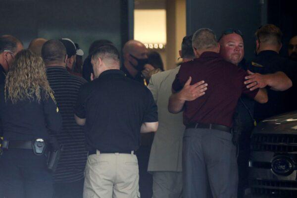 Police officers gather at the hospital where two Houston police officers were sent to after being shot while serving an arrest warrant, at Memorial Hermann Hospital in Houston, Texas, on Sept. 20, 2021. (Yi-Chin Lee/Houston Chronicle via AP)