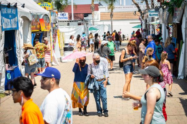 People enjoy the opening day of the Orange County Fair in Costa Mesa, Calif., on July 16, 2021. (John Fredricks/The Epoch Times)