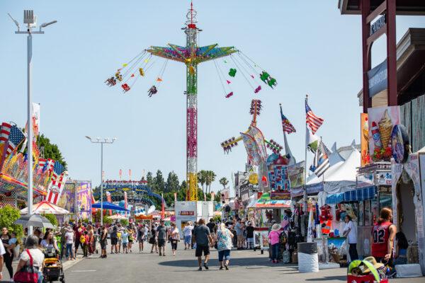 People enjoy the opening day of the Orange County Fair in Costa Mesa, Calif., on July 16, 2021. (John Fredricks/The Epoch Times)