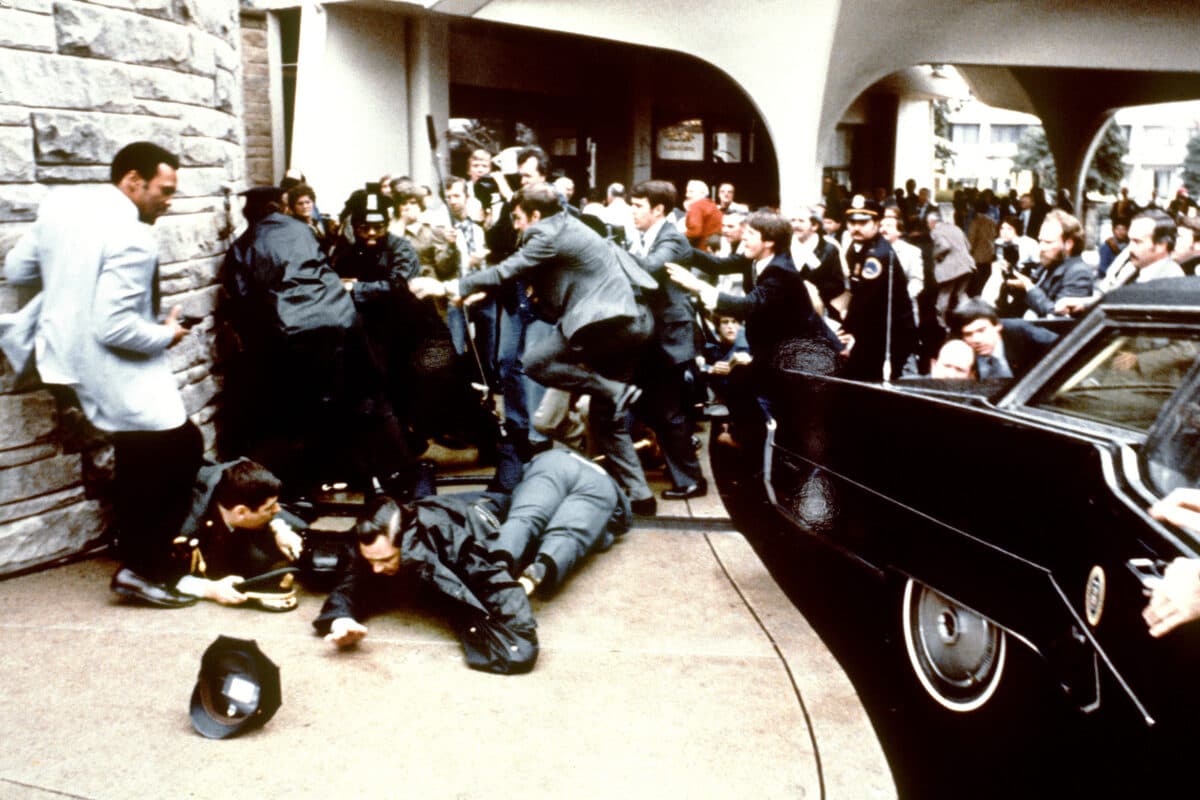 Police and Secret Service agents reacting during the assassination attempt on President Ronald Reagan in Washington on March 30, 1981. (Mike Evens/AFP via Getty Images)