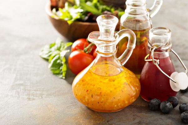 A simple dressing of olive oil and vinegar is both good for your health and easy on your pocketbook. (Elena Veselova/Shutterstock)