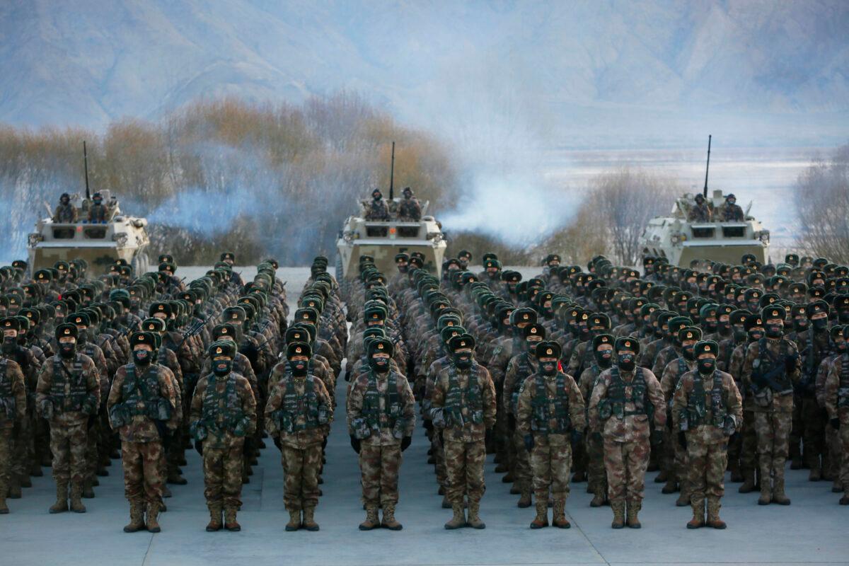 Chinese People's Liberation Army soldiers assembly during military training on the Pamir Mountains in Kashgar, northwestern China's Xinjiang autonomous region, on Jan. 4, 2021. (STR/AFP via Getty Images)