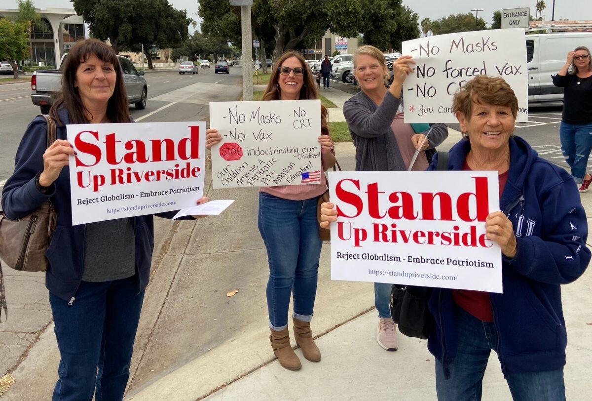 Parents and teachers hold signs in protest at Riverside Unified School District in Riverside, Calif., on Oct. 7, 2021. (Courtesy of Heather Knapp)