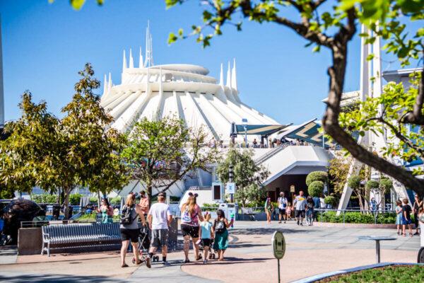 Guests arrive in Tomorrowland at the Disneyland Resort in Anaheim, Calif., on April 30, 2021. (Richard Harbaugh/Disneyland Resort via Getty Images)