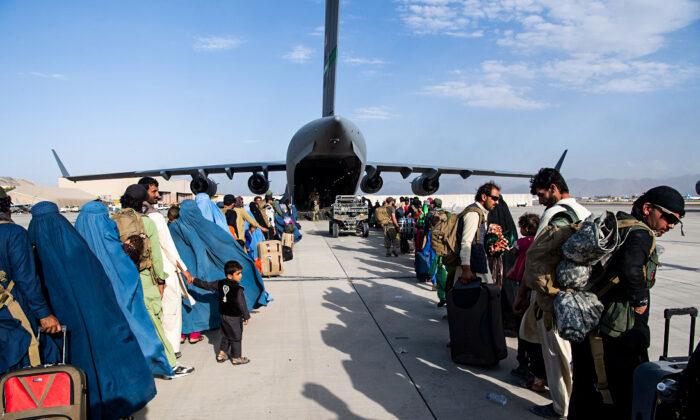 Passengers board a U.S. Air Force C-17 at Hamid Karzai International Airport in Kabul, Afghanistan, on Aug. 24, 2021. (Master Sgt. Donald R. Allen/U.S. Air Forces Europe-Africa via Getty Images)