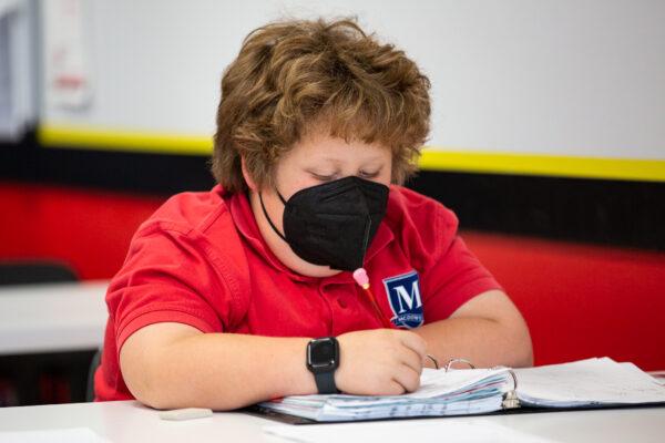 Student Kegan Pichardo performs a math assignment at Mathnasium, in Laguna Niguel, Calif., on May 12, 2021. (John Fredricks/The Epoch Times)
