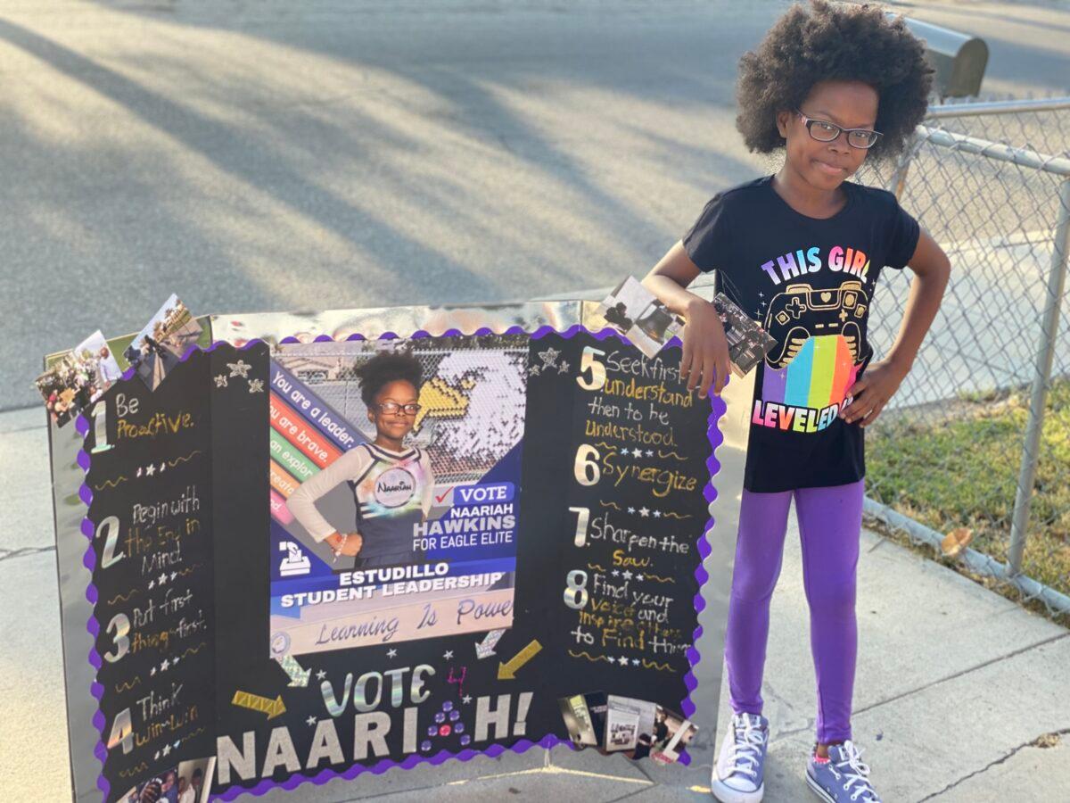 Naariah Hawkins displays a poster she made for school. (Courtesy Brian Hawkins)