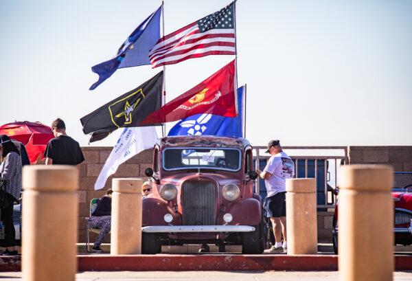 Veterans and civilians celebrate Veterans Day in Huntington Beach, Calif., on Nov. 11, 2021. (John Fredricks/The Epoch Times)
