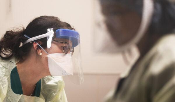 Health care workers care for a patient in Coronado, Calif., on May 7, 2020. (Mario Tama/Getty Images)