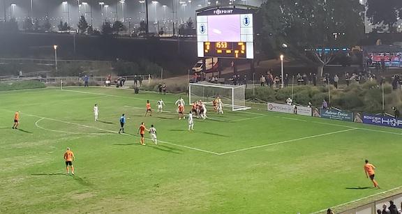 One of the many long throw-ins by Brent Richards of OCSC during the USL Western Conference final in Irvine, Calif., on Nov. 20, 2021. (Nhat Hoang/Epoch Times)