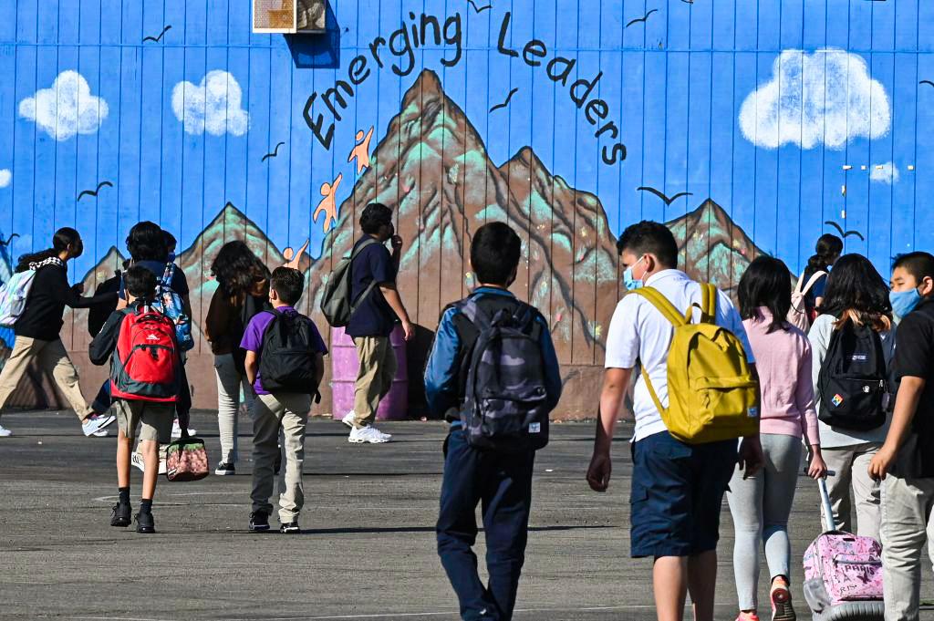 Students walk to their classrooms at a public middle school in Los Angeles on Sept. 10, 2021. (Robyn Beck/AFP via Getty Images)