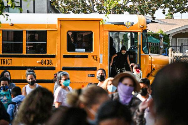 Students and parents arrive masked for the first day of the school year at Grant Elementary School in Los Angeles on Aug. 16, 2021. (Robyn Beck/AFP via Getty Images)