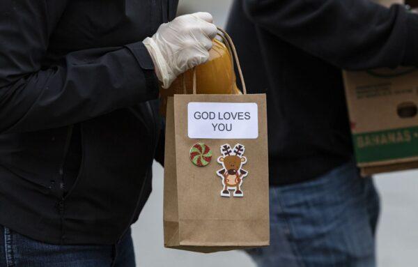 The Family Assistance Ministries, a faith-based non-profit organization, distributed about 1,000 pounds of food ahead of Christmas to Orange County families in need at the Laguna Niguel Presbyterian Church in Laguna Niguel, Calif., on Dec. 23, 2021. (John Fredricks/The Epoch Times)