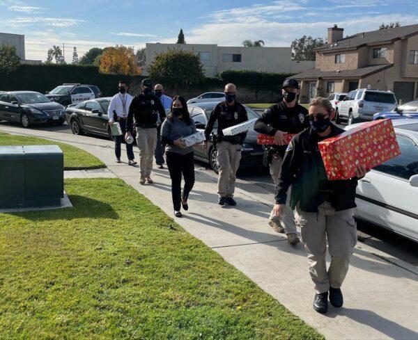 The Huntington Beach Police Department made a local family’s Christmas a little more special this year by showing up on their doorstep with toys for their three boys in Huntington Beach, Calif., on Dec. 22, 2021. (Courtesy of Huntington Beach Police Department)