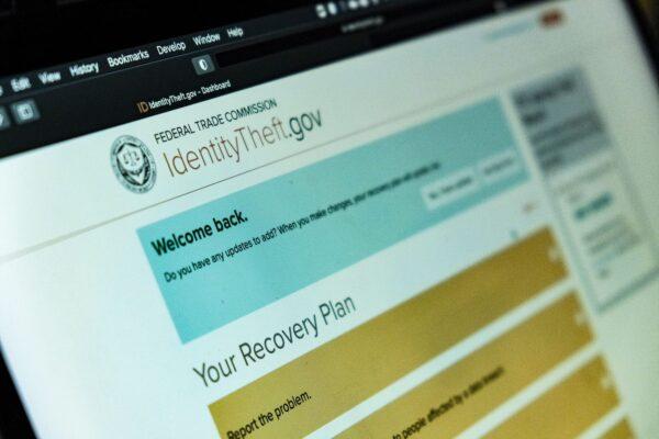 Tanner Grimshaw looks over his identity theft case in Irvine, Calif., on Jan. 31, 2022. (John Fredricks/The Epoch Times)