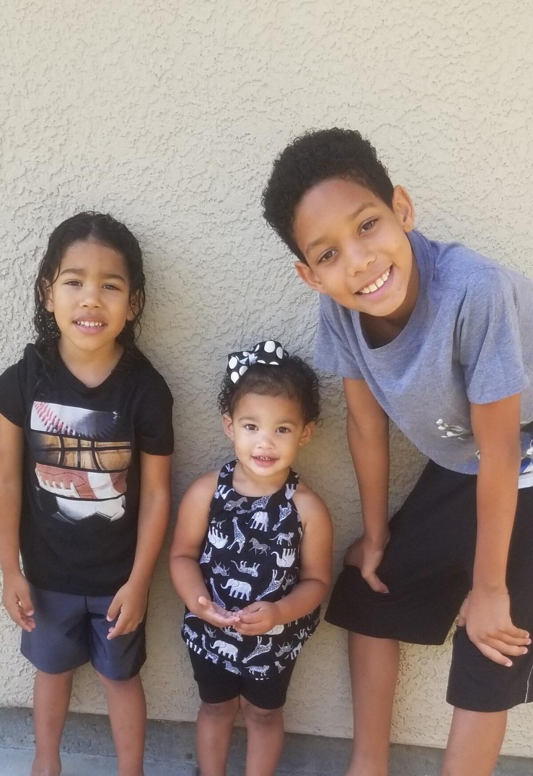 A family receives assistance from the Costa Mesa-based organization Serving People in Need. (Courtesy of Serving People in Need)