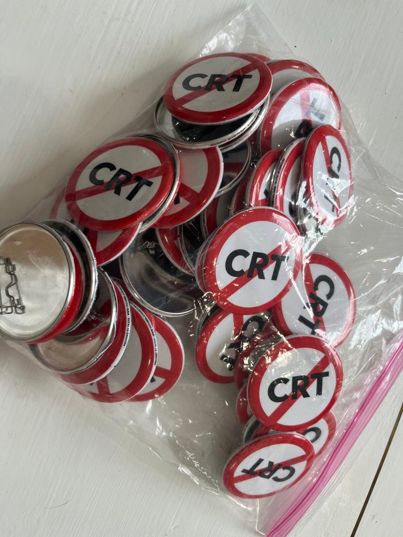 Parents concerned about Critical Race Theory took home these buttons from a school board activist training Jan. 19, 2022 in Sarasota, Florida. (Alexis Spiegelman)