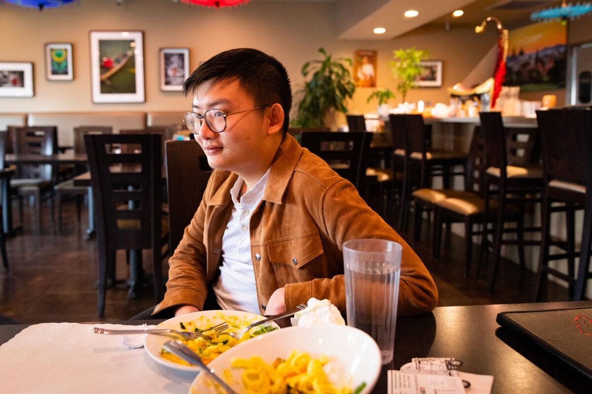 Thet Lin Tun, President of UCLA's Burmese Student Association enjoys a visit at Irrawady Taste of Burma in Stanton, Calif., on March 12, 2021. (John Fredricks/The Epoch Times)