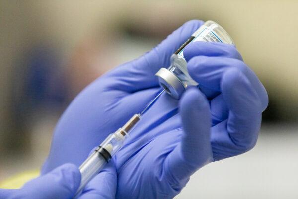 The COVID-19 Moderna vaccination was prepared at Lestonnac Free Clinic in Orange, Calif., on March 9, 2021. (John Fredricks/The Epoch Times)