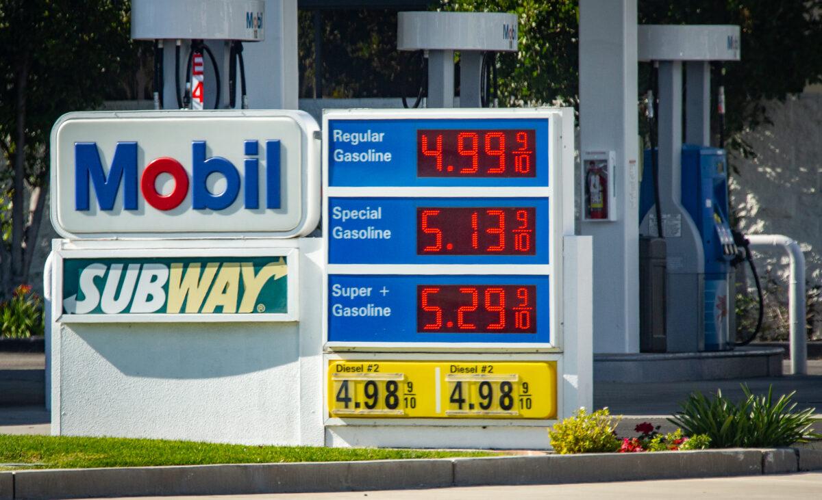 Gas stations serve customers at peak prices in Irvine, Calif., on Feb. 23, 2022. (John Fredricks/The Epoch Times)