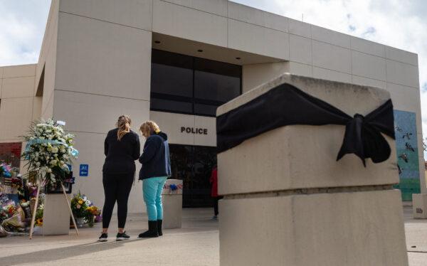 A growing memorial of flowers for the passing of Huntington Beach Police Officer Nicholas Vella is displayed near the Huntington Beach Police station in Huntington Beach, Calif., on Feb. 22, 2022. (John Fredricks/The Epoch Times)