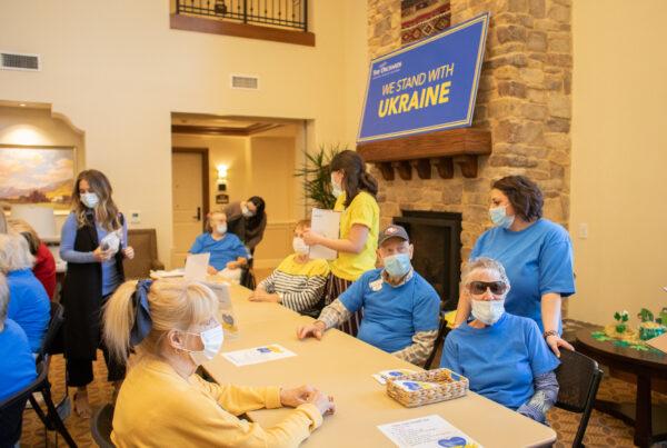 Seniors and medical staff at The Orchards Health Center help create and load first-aid kits to be delivered to Ukraine in Ranch Mission Viejo, Calif., on March 15, 2022. (John Fredricks/The Epoch Times)