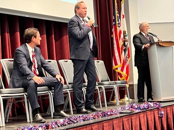 California Republican candidates for Attorney General Eric Early (C) and Nathan Hoffman (L) with mayor pro tem of Yorba Linda Gene Hernandez (R) moderating, at a “Meet the Candidates” forum at the Yorba Linda Community Center in Yorba Linda, Calif., on March 24, 2022. (Brad Jones/The Epoch Times)