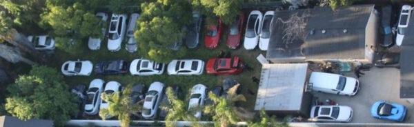 The stolen luxury cars stashed in a backyard in Los Angeles' San Fernando Valley on March 24, 2022. (California Highway Patrol/TNS)